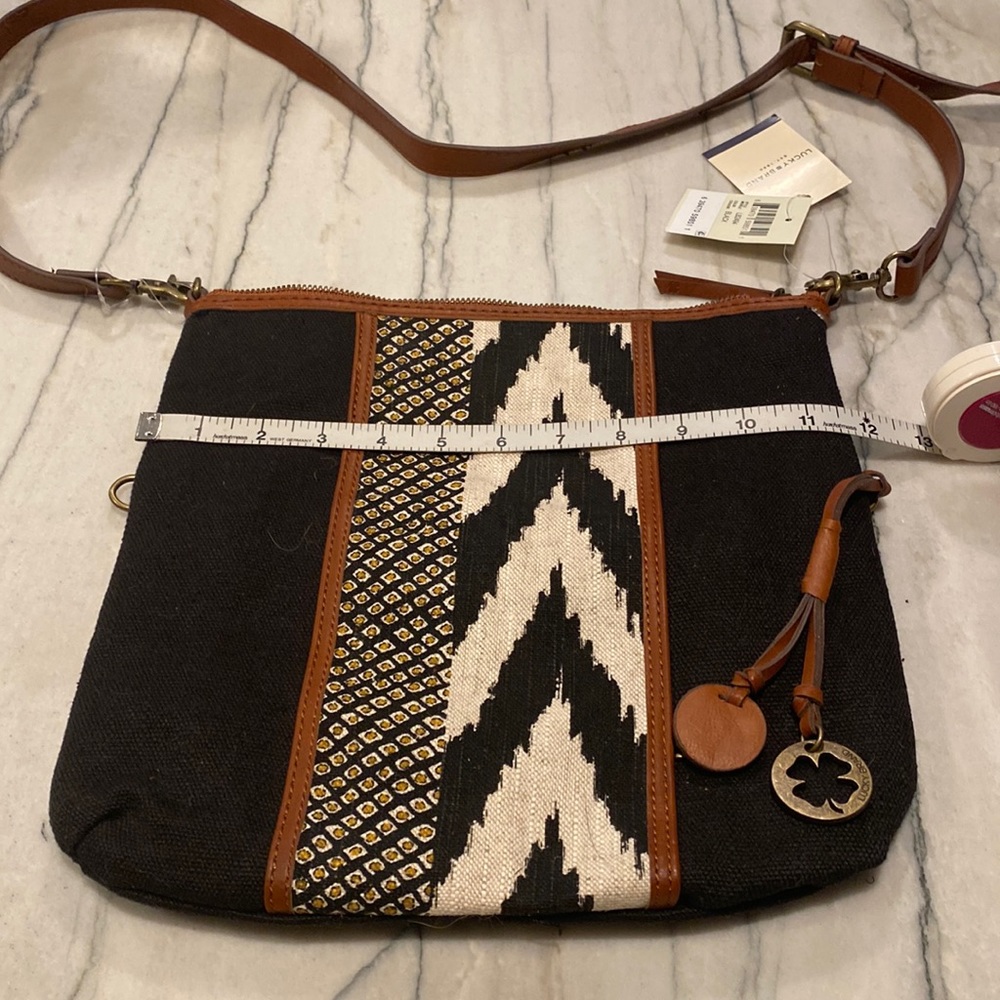 Lucky Brand Canvas Black Bag NWT with black/white design - with 2 bag charms